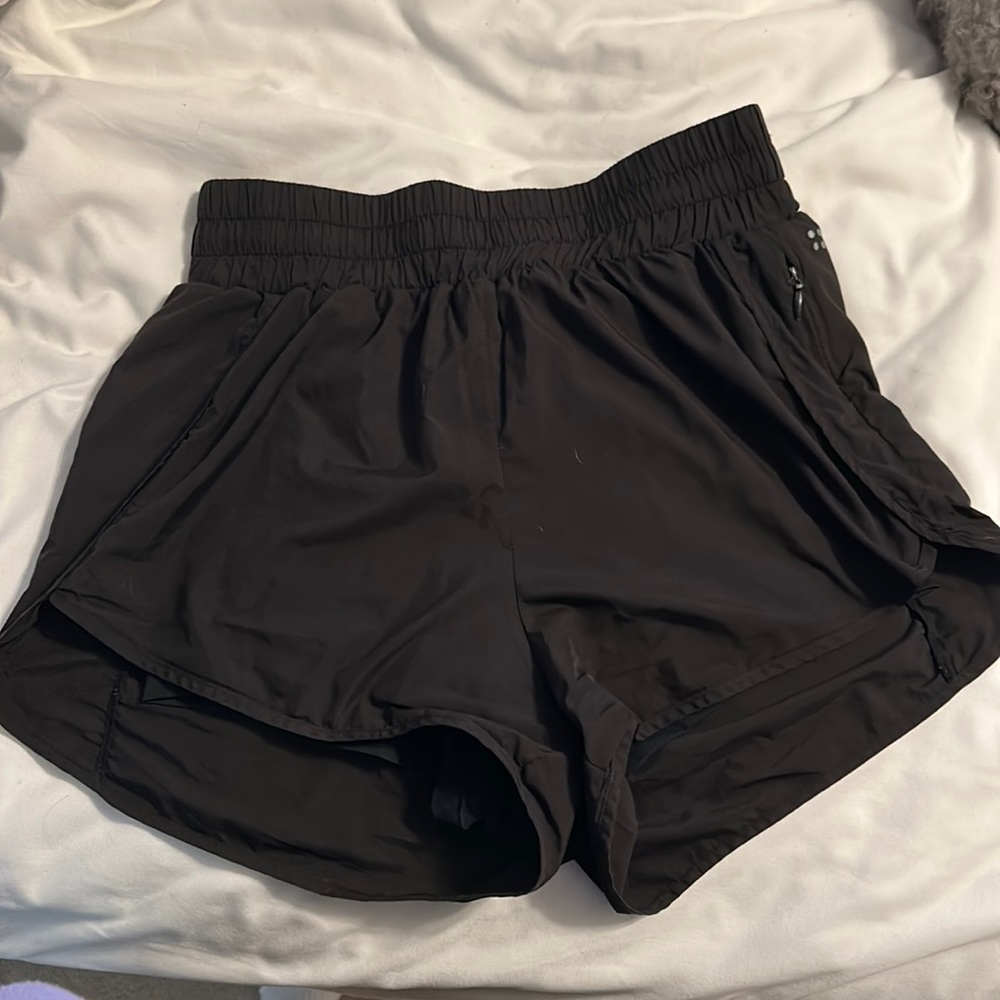 ACTA athleisure brand — black high waisted running shorts